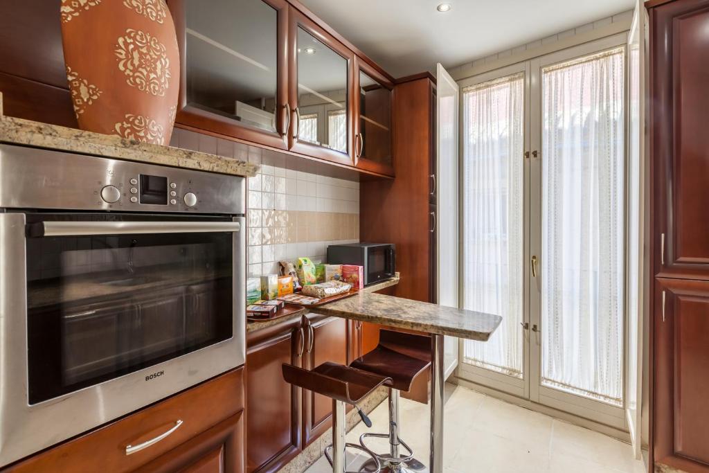 A kitchen or kitchenette at Atico de lujo en Aguilas