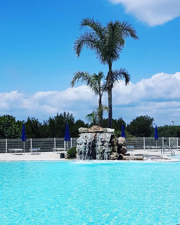Bazén v ubytování Hotel Resort Portoselvaggio nebo v jeho okolí