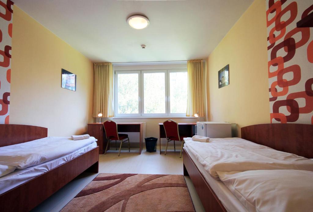Postel nebo postele na pokoji v ubytování LC - Hotel Ostrava