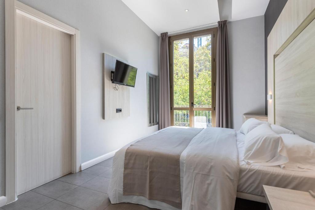 Postel nebo postele na pokoji v ubytování Plaza Goya Rooms