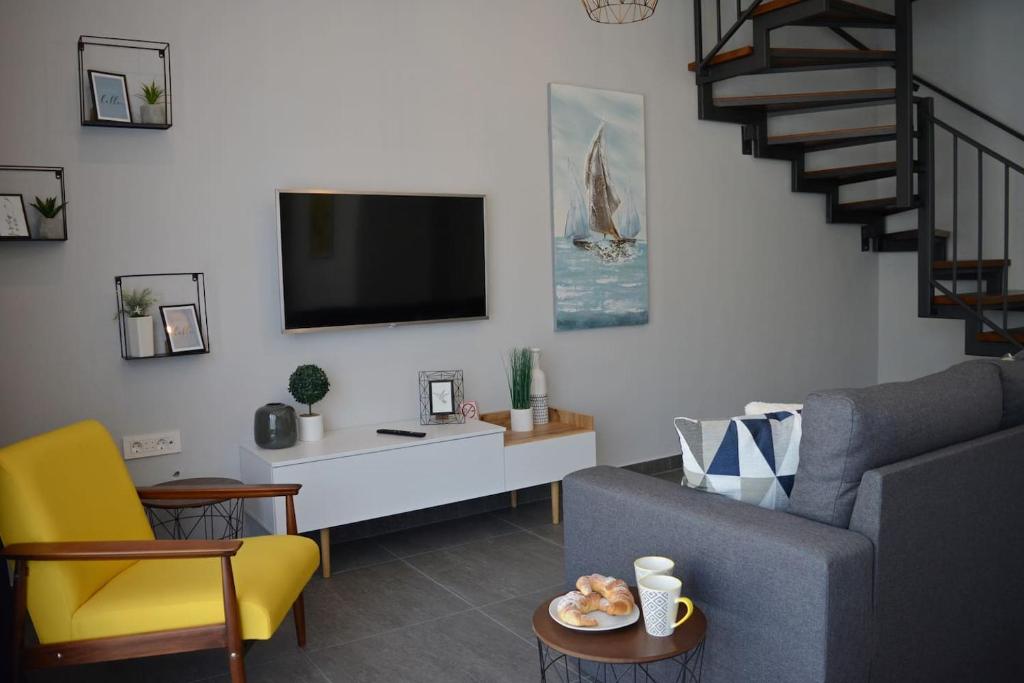Televízia a/alebo spoločenská miestnosť v ubytovaní Amarena Holiday Home in Škrljevo