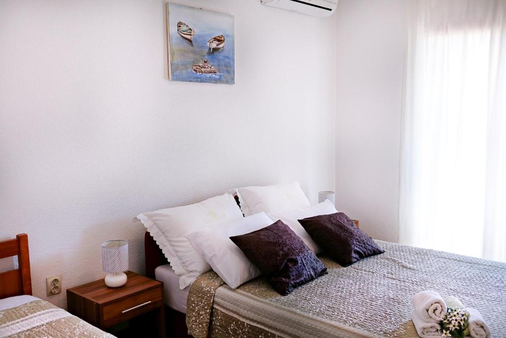 Postel nebo postele na pokoji v ubytování Apartmani Obala