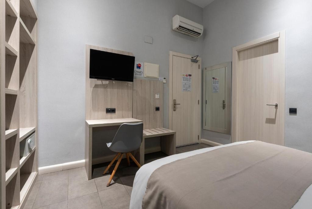 TV a/nebo společenská místnost v ubytování Plaza Goya Rooms