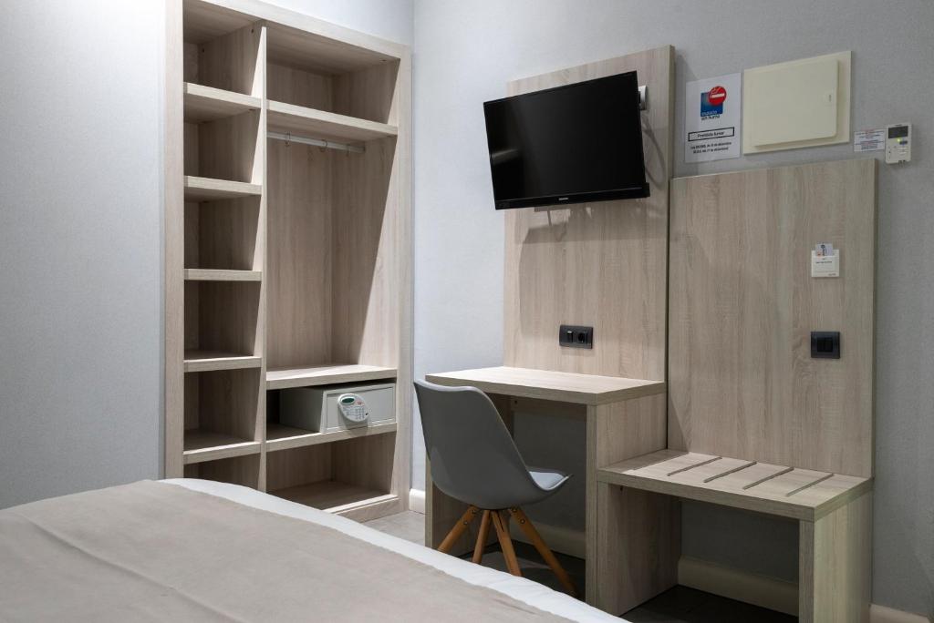 TV a/nebo společenská místnost v ubytování Plaza Goya Rooms