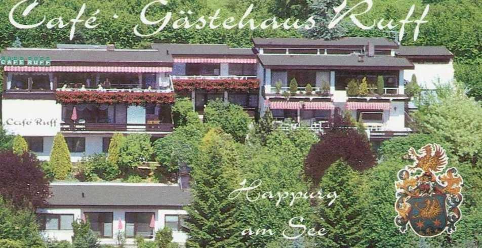 a picture of a building in the middle of trees at Gästehaus Café Ruff in Happurg