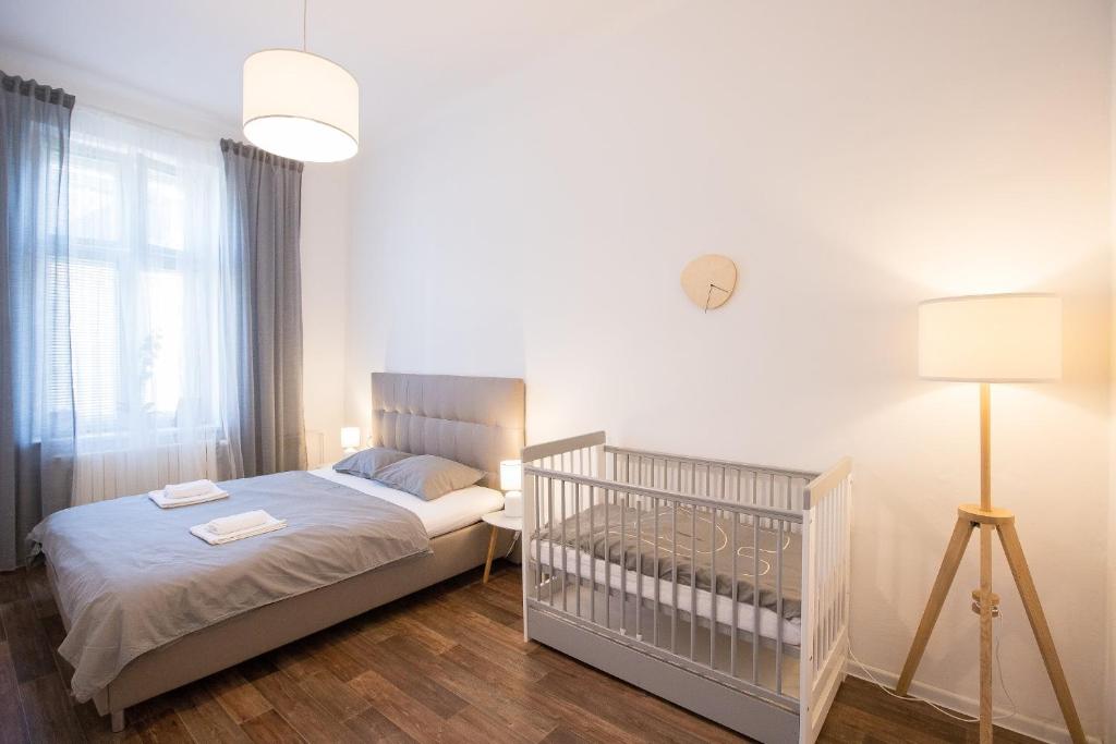 Postel nebo postele na pokoji v ubytování FAMILY Apartment OSTRAVA