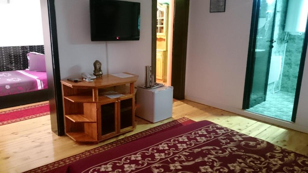 Postel nebo postele na pokoji v ubytování Rimini Club Inn & Suites