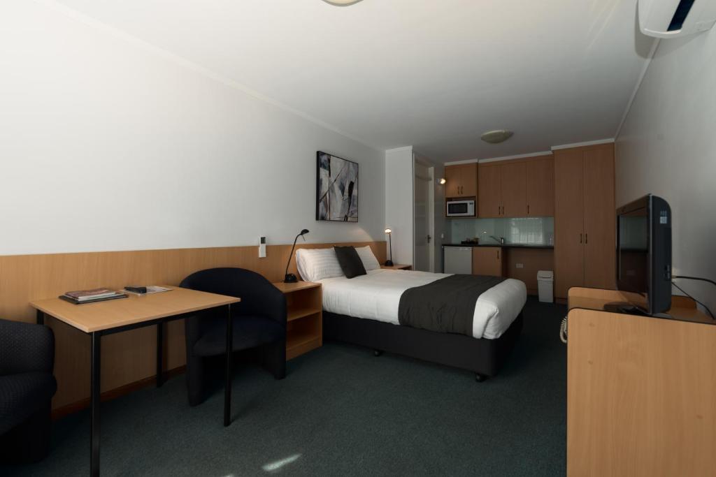 Postel nebo postele na pokoji v ubytování Barclay Motor Inn