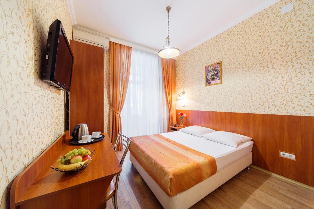 Cama o camas de una habitación en Hotel Tonika