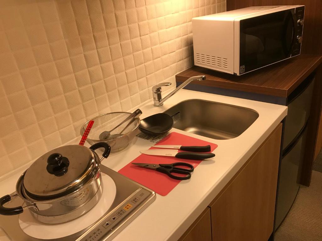 Kuchyň nebo kuchyňský kout v ubytování Hotel Yururito Osaka