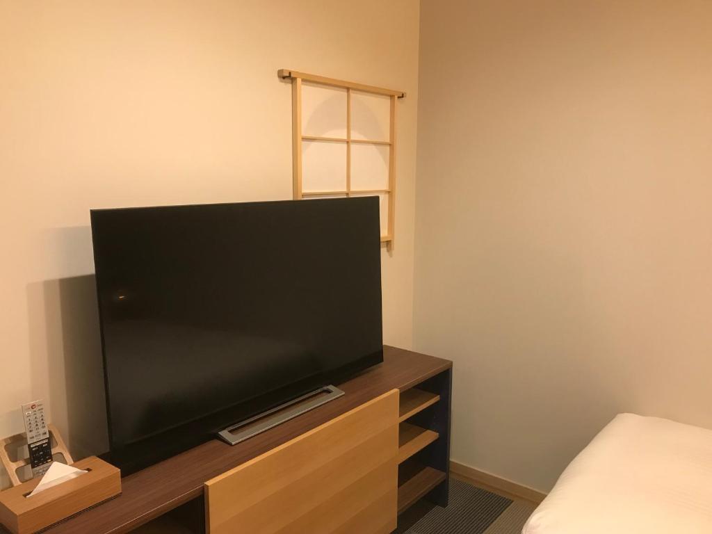 TV a/nebo společenská místnost v ubytování Hotel Yururito Osaka