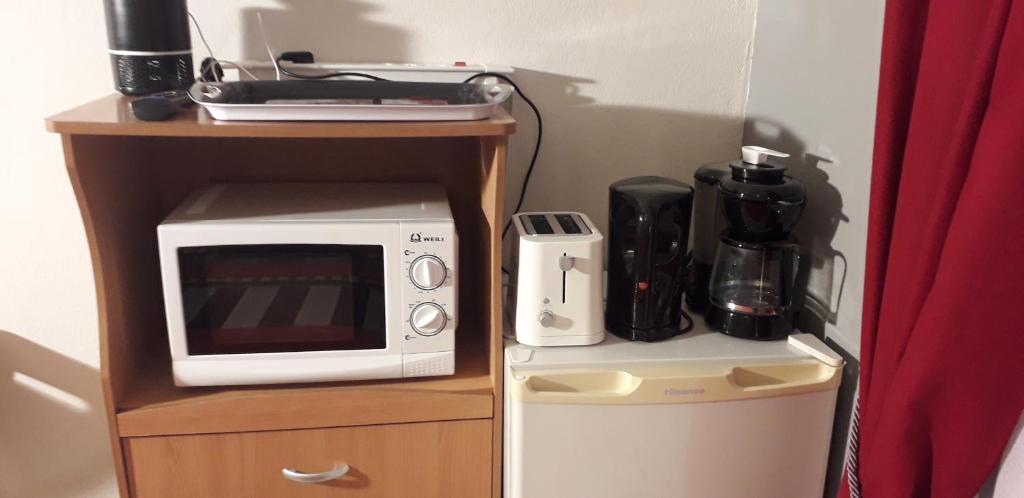 Kuchyň nebo kuchyňský kout v ubytování Happyhome