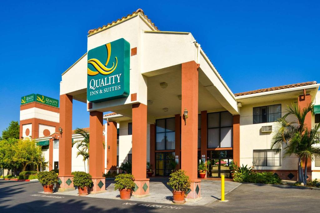 a hotel with a sign that reads quality inn suites at Quality Inn & Suites Walnut - City of Industry in Walnut