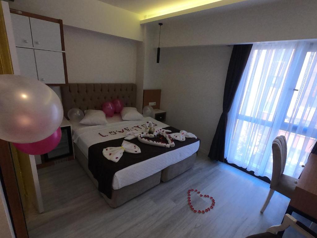 Postel nebo postele na pokoji v ubytování Tymbris Hotel Eskisehir