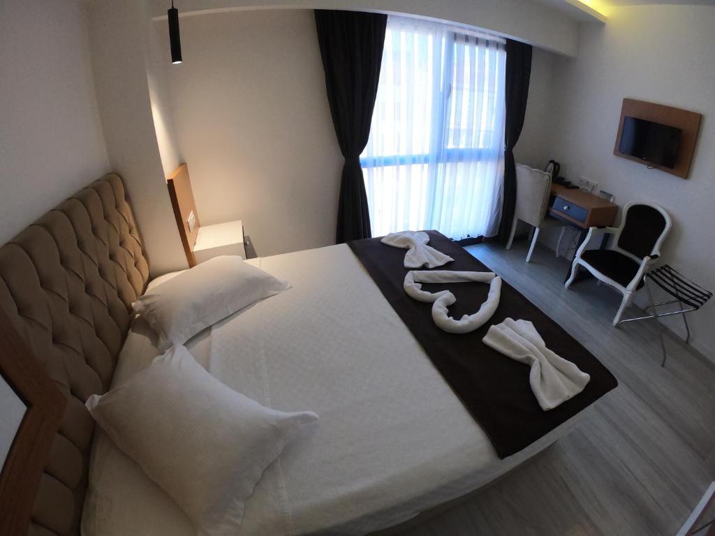 Postel nebo postele na pokoji v ubytování Tymbris Hotel Eskisehir