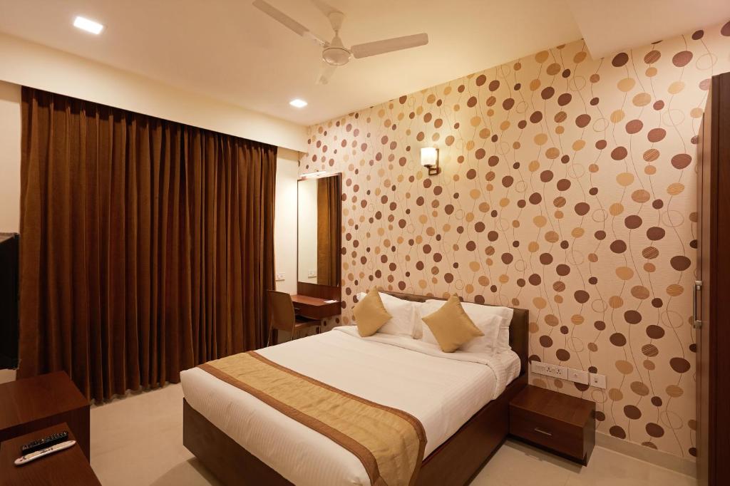 Katil atau katil-katil dalam bilik di Hotel Kamar Residences and Banquets