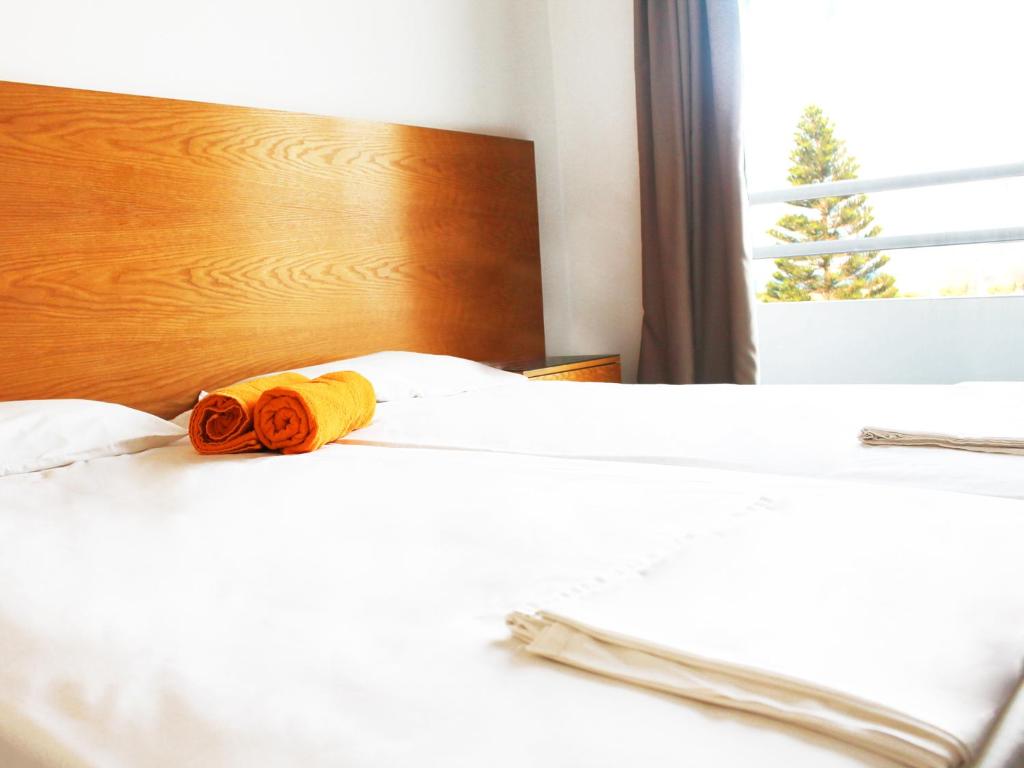 Postel nebo postele na pokoji v ubytování Rebioz Hotel