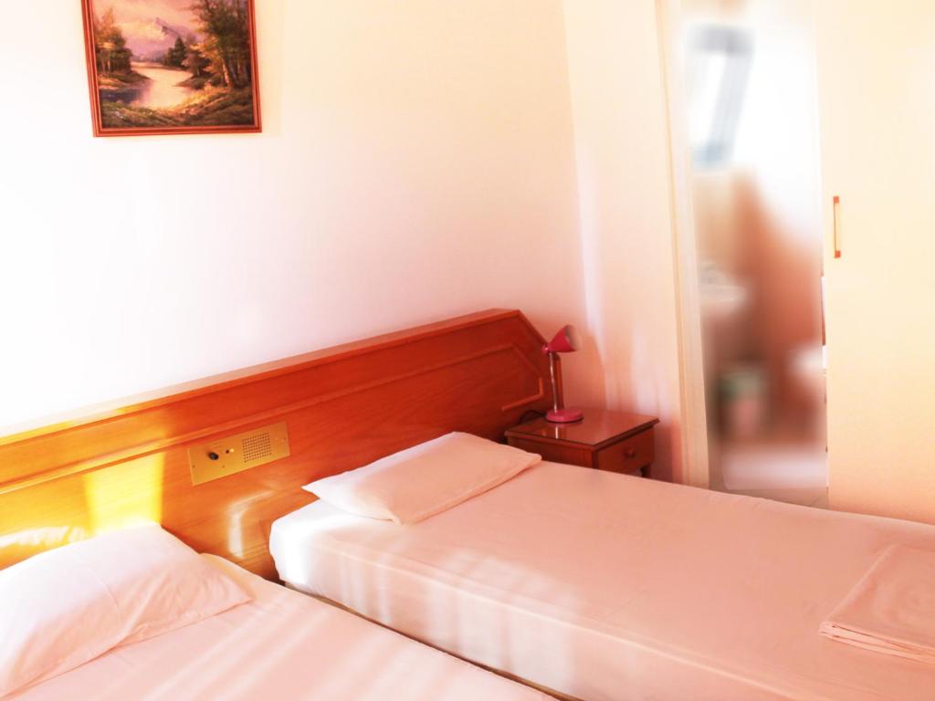 Postel nebo postele na pokoji v ubytování Rebioz Hotel