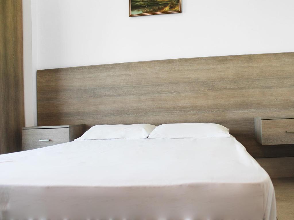 Postel nebo postele na pokoji v ubytování Rebioz Hotel