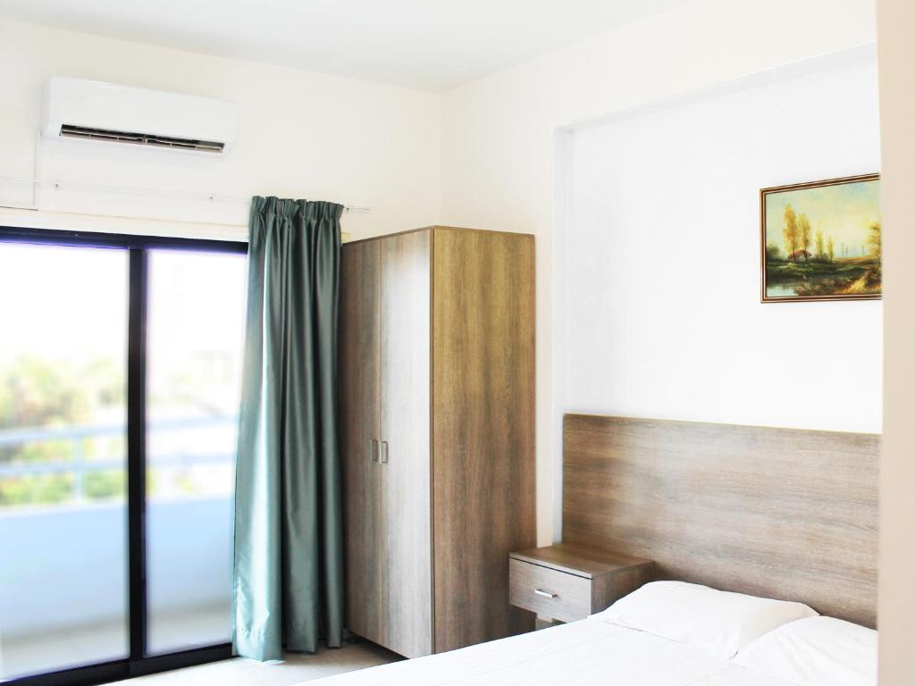 Postel nebo postele na pokoji v ubytování Rebioz Hotel