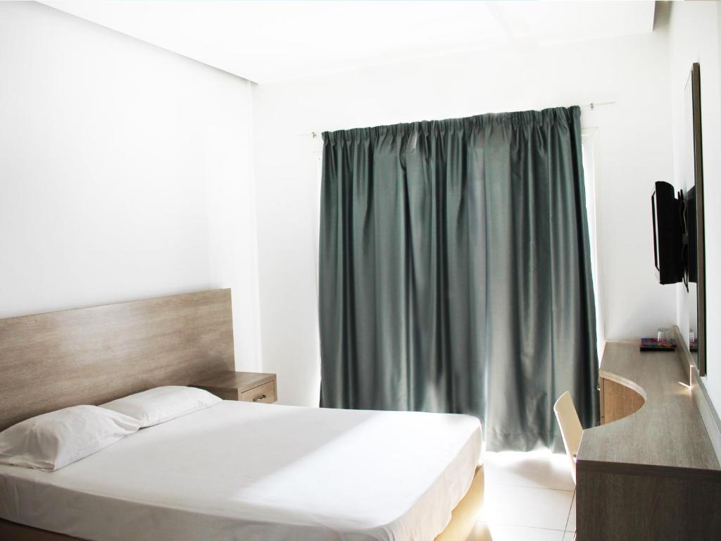 Postel nebo postele na pokoji v ubytování Rebioz Hotel