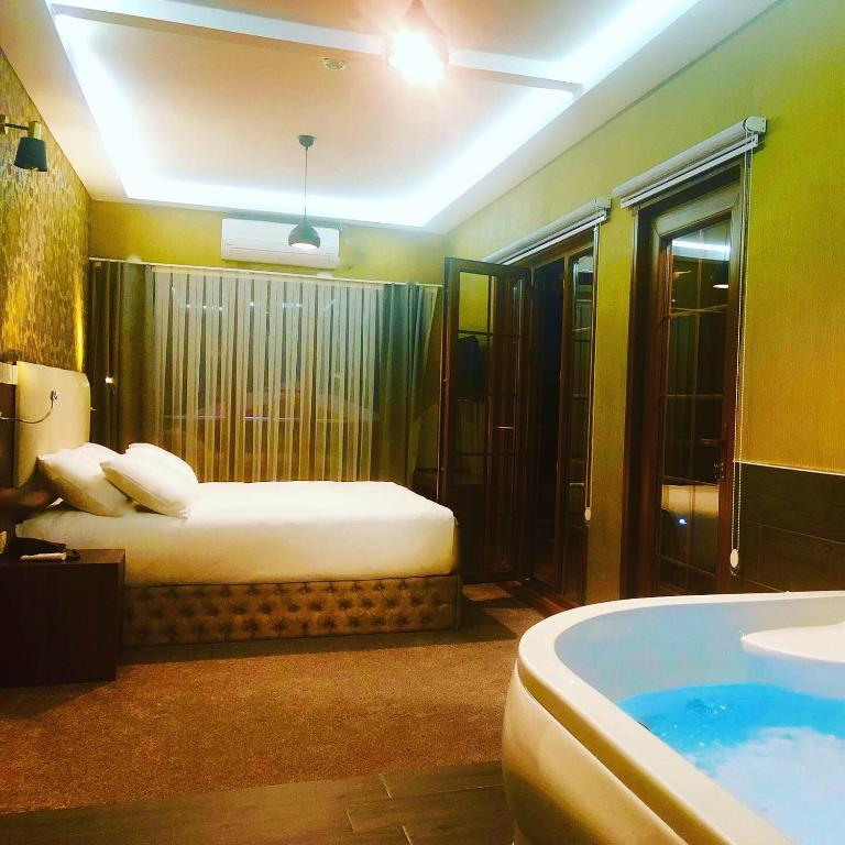Postel nebo postele na pokoji v ubytování Villa Da Otel