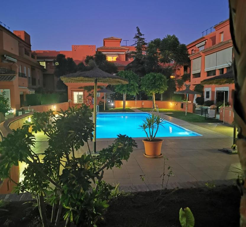 a view of a swimming pool at night at Natipao in Rota