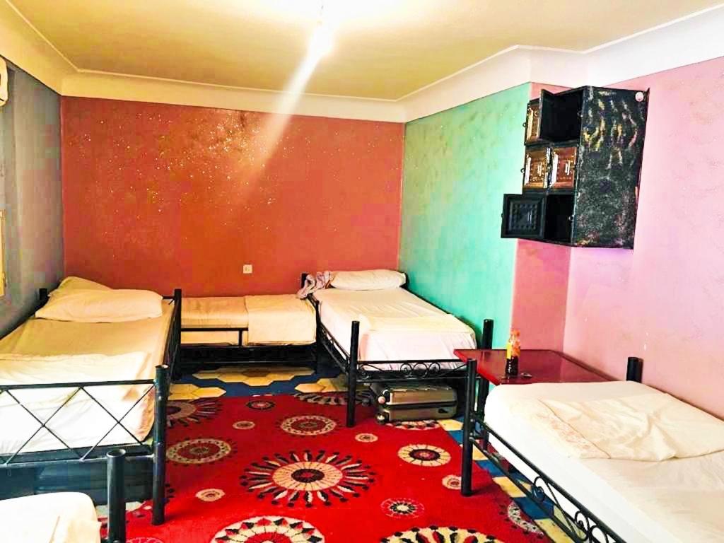 Postel nebo postele na pokoji v ubytování Riad Dia