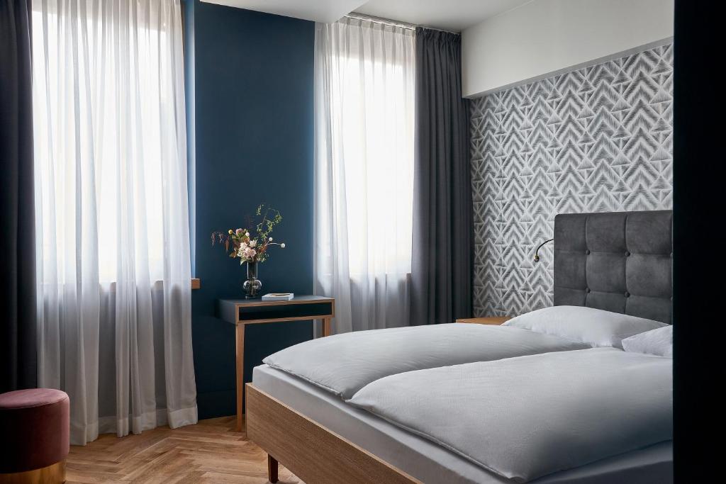 Postel nebo postele na pokoji v ubytování Hotel MIO by AMANO