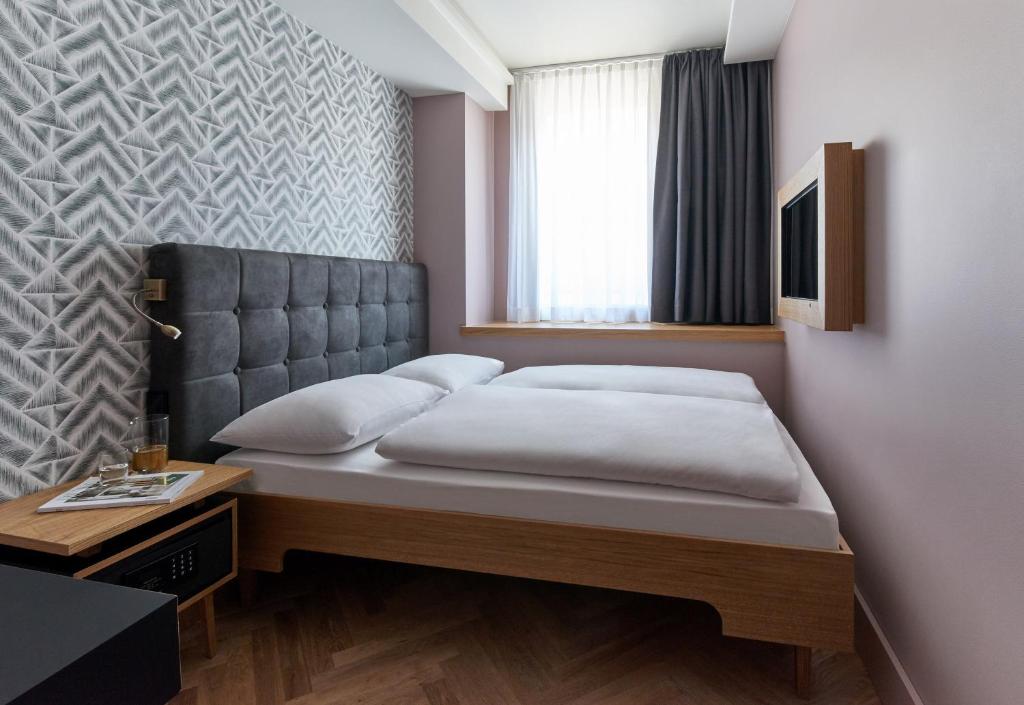 Postel nebo postele na pokoji v ubytování Hotel MIO by AMANO