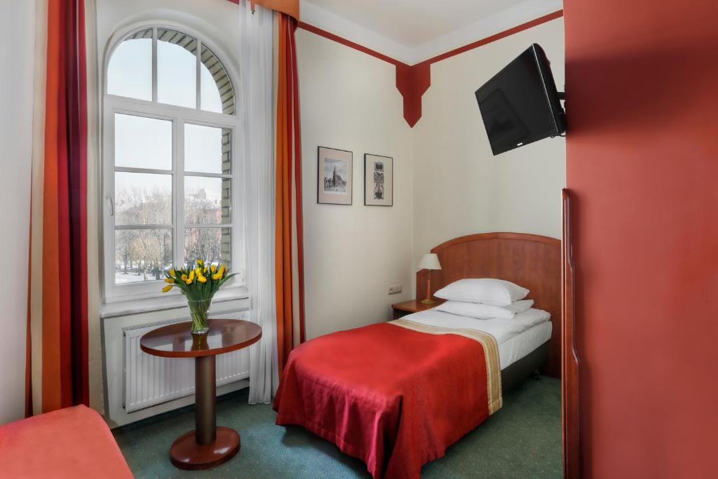 Postel nebo postele na pokoji v ubytování Dom Muzyka