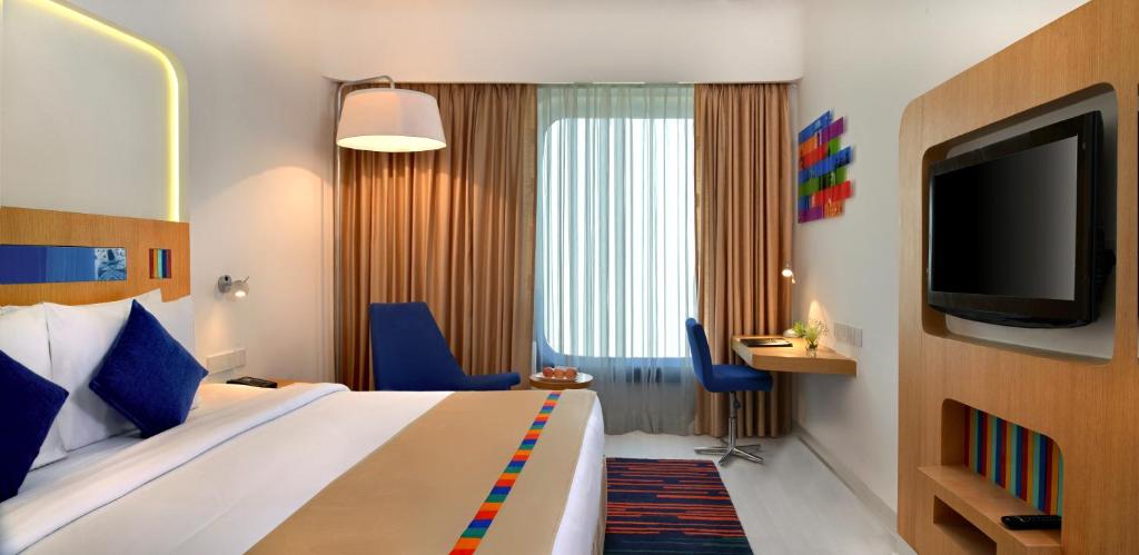 TV a/nebo společenská místnost v ubytování Park Inn by Radisson New Delhi IP Extension