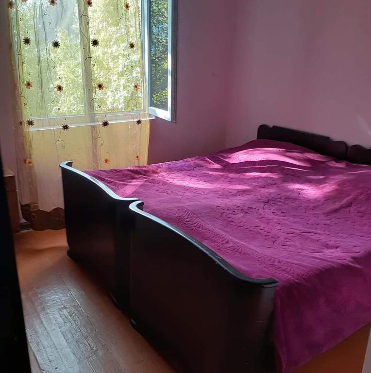 Postel nebo postele na pokoji v ubytování Guest House Malkhaz Niguriani