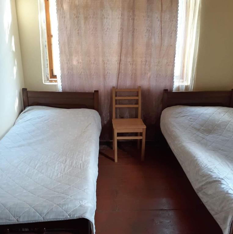 Postel nebo postele na pokoji v ubytování Guest House Malkhaz Niguriani