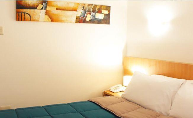 Cama o camas de una habitación en Hotel Romano