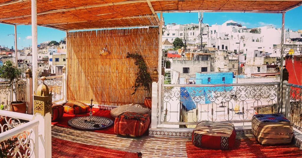 a balcony with a view of a city at The Riad Hostel Tangier in Tangier