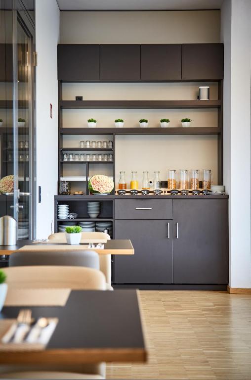 Kuchyň nebo kuchyňský kout v ubytování Hotel Vivendi