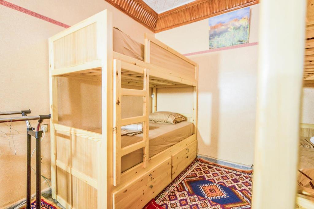 Postel nebo postele na pokoji v ubytování Dar Widad