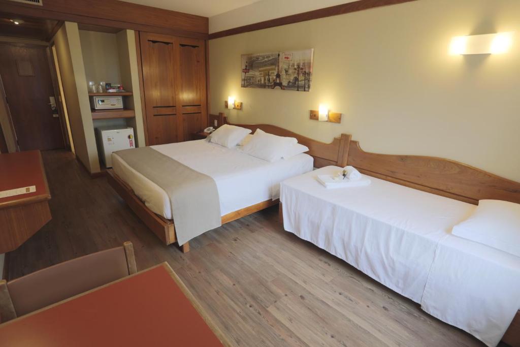Postel nebo postele na pokoji v ubytování Tri Hotel