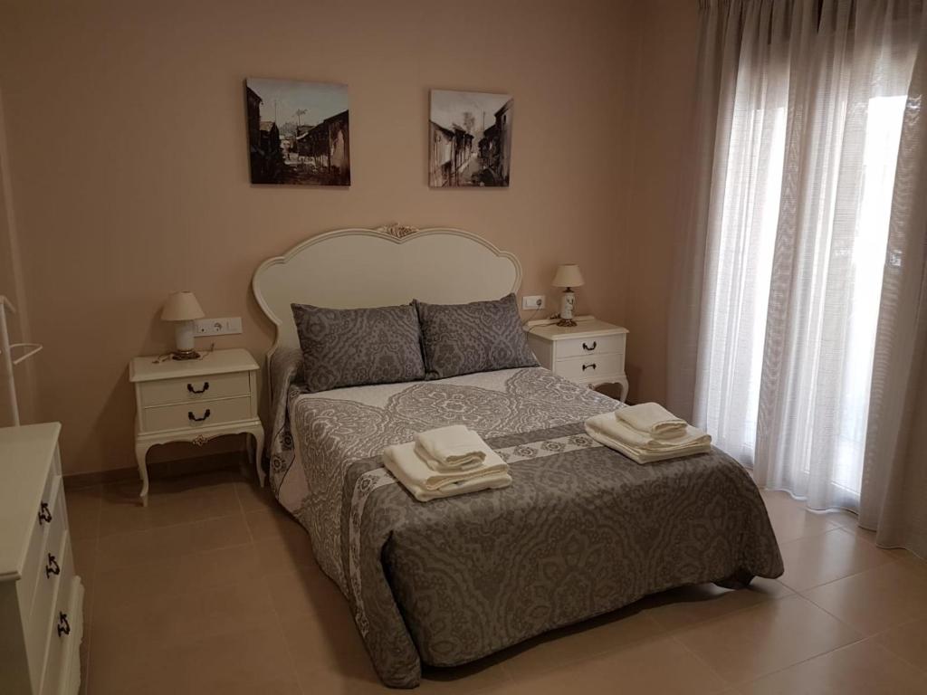 Cama ou camas em um quarto em Apartamentos HELA