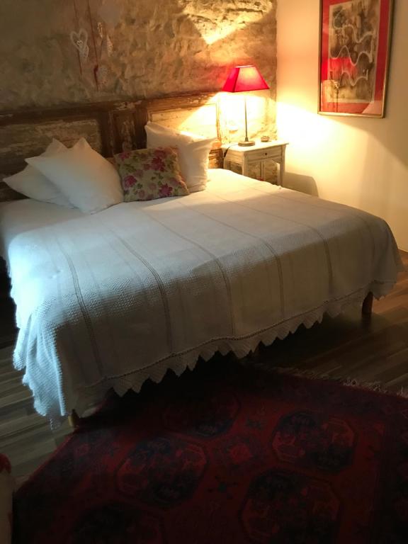 Säng eller sängar i ett rum på La maison d' Elizabeth