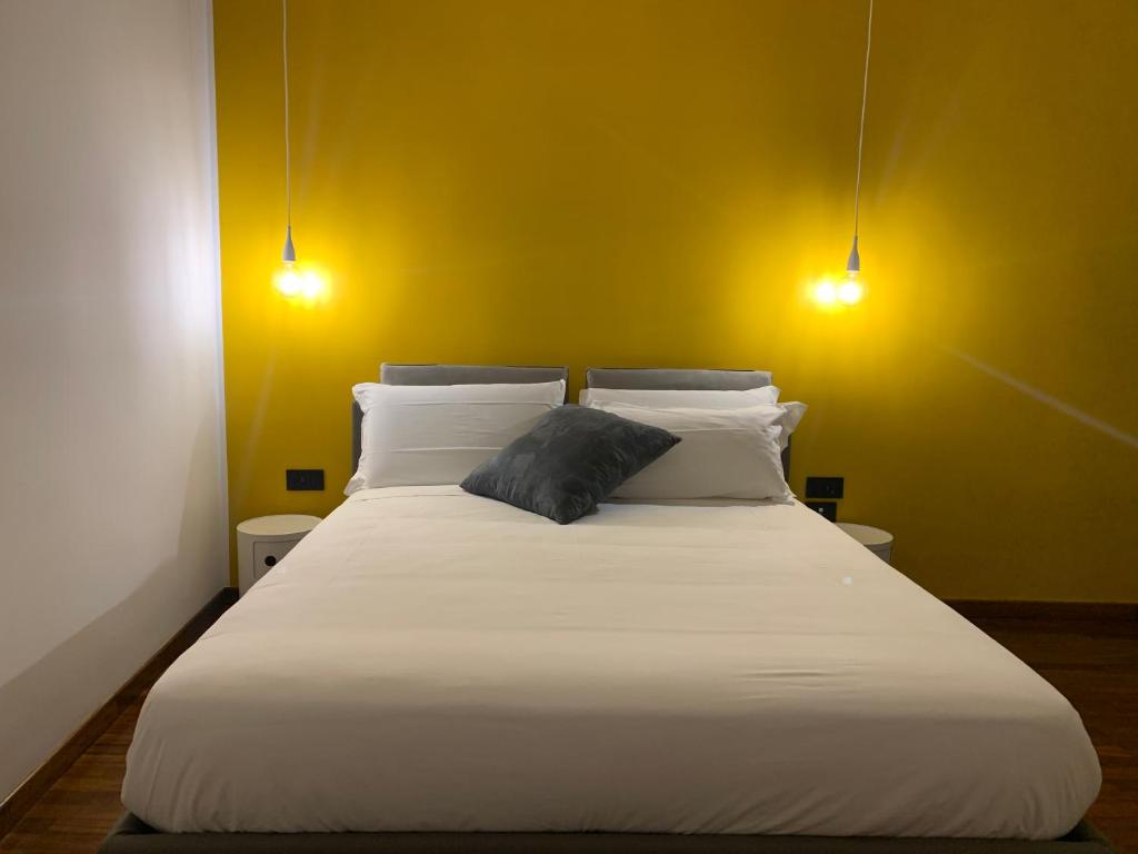 Łóżko lub łóżka w pokoju w obiekcie Cellamare Suite & Spa