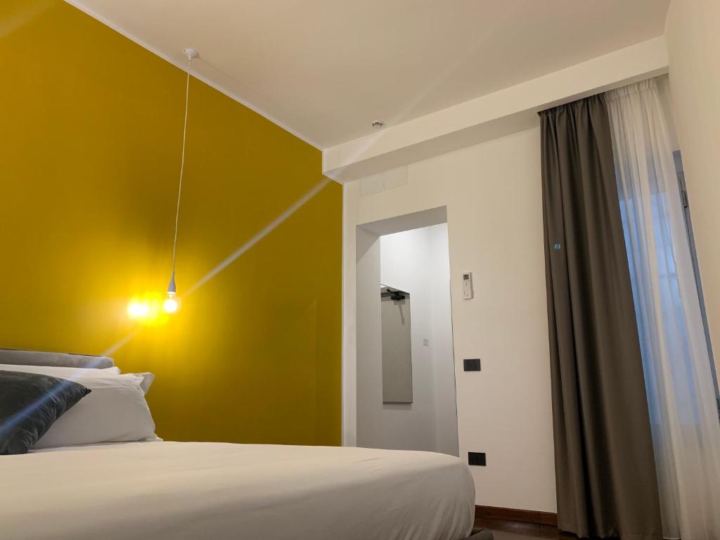 Łóżko lub łóżka w pokoju w obiekcie Cellamare Suite & Spa