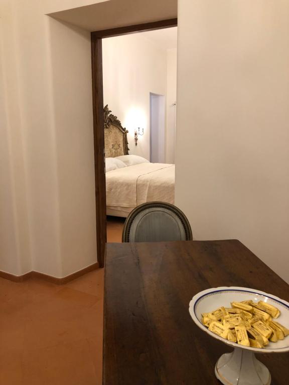 A bed or beds in a room at Visione Via Sant’Andrea delle Fratte, 36