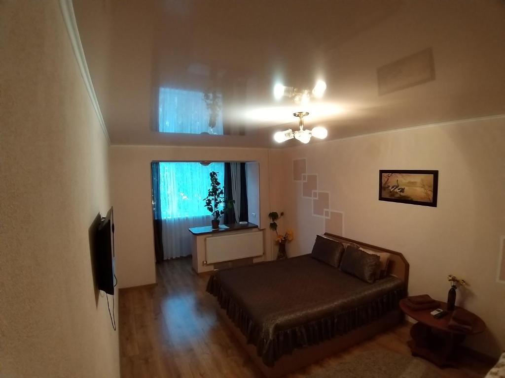 Postel nebo postele na pokoji v ubytování Апартаменты