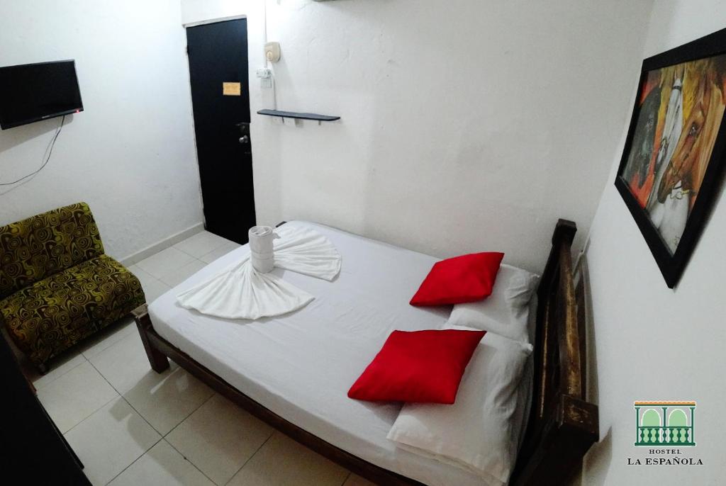 Postel nebo postele na pokoji v ubytování Hostal La Española de Getsemani