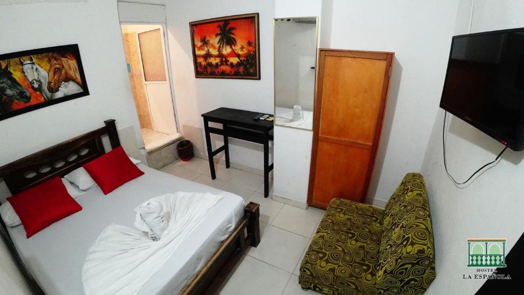 Postel nebo postele na pokoji v ubytování Hostal La Española de Getsemani
