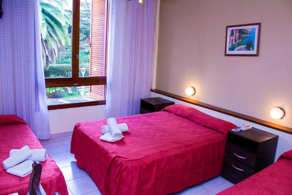 En eller flere senge i et værelse på San Remo Park Hotel