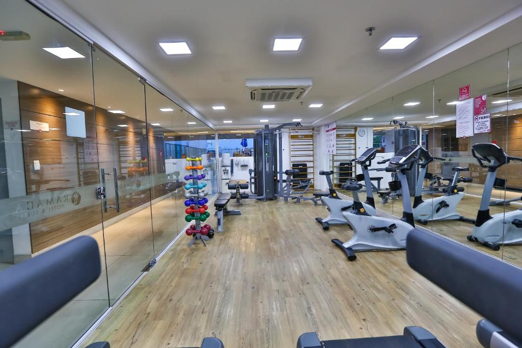 a gym with treadmills and elliptical machines at Roomo Praia de Boa Viagem Residencial in Recife
