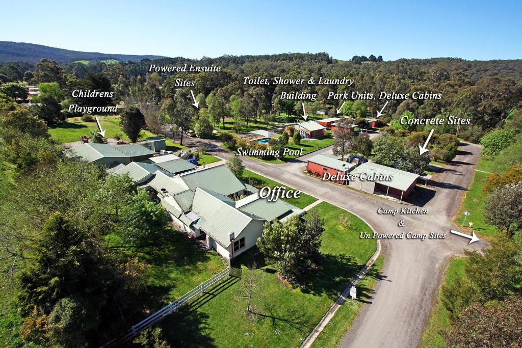 an aerial view of a farm with a road and buildings at Otways Tourist Park in Gellibrand
